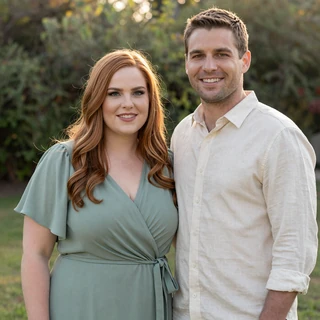 Kaci and Collin standing together in a garden after their wedding